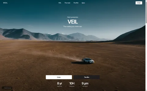 VEIL: a white SUV crossing a desert floor under pale mountains, the word VEIL centred, Tesla-quiet type and two pills over native 4K film.