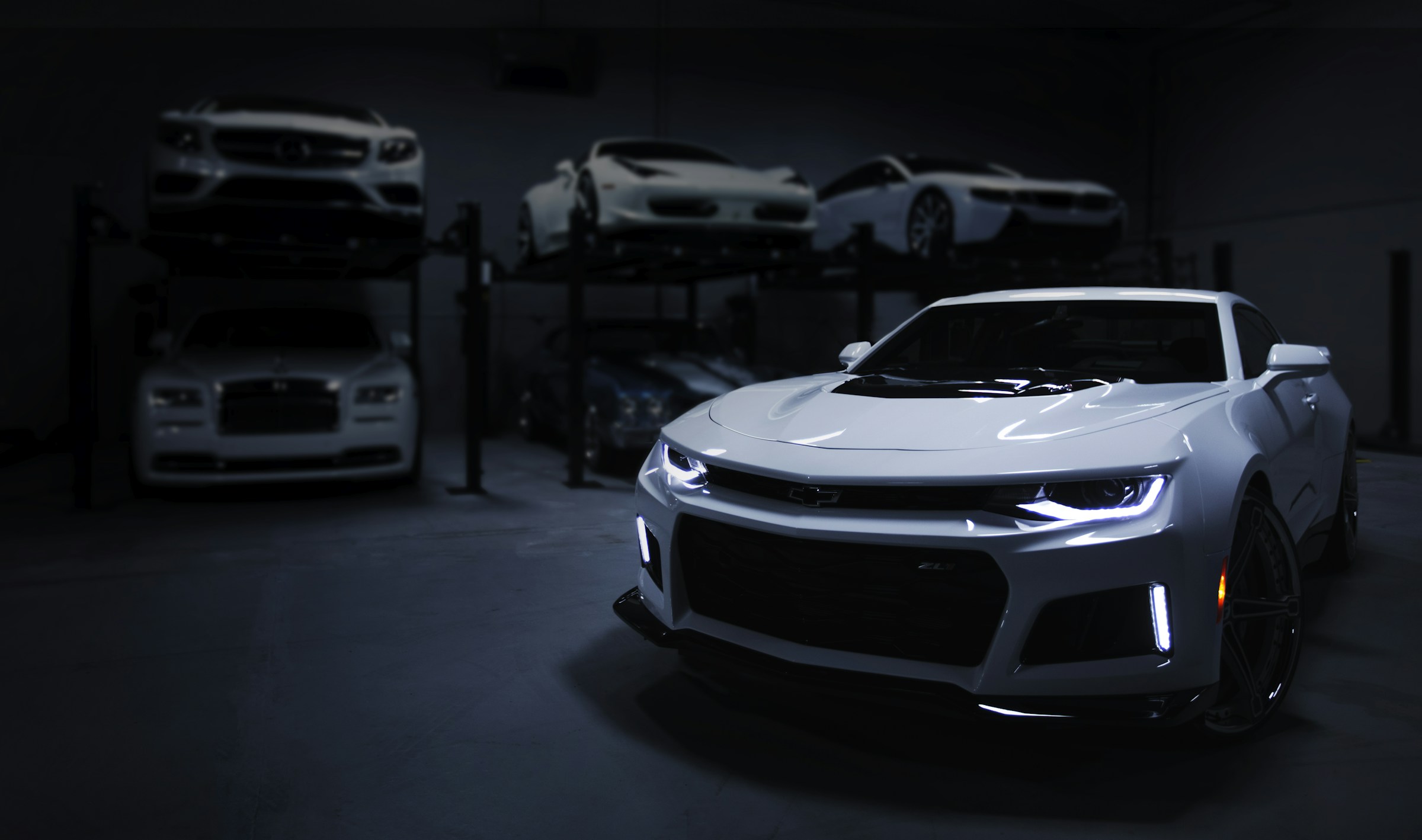 VERIDEX homepage: full-bleed automotive showroom video behind the wordmark VERIDEX and the headline One customer. One clean record.