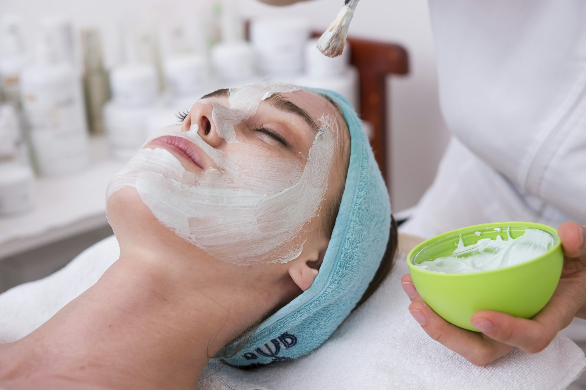 Lume Skin: soft sage hero with ‘Skin that settles into itself’ over a facial ritual video still.