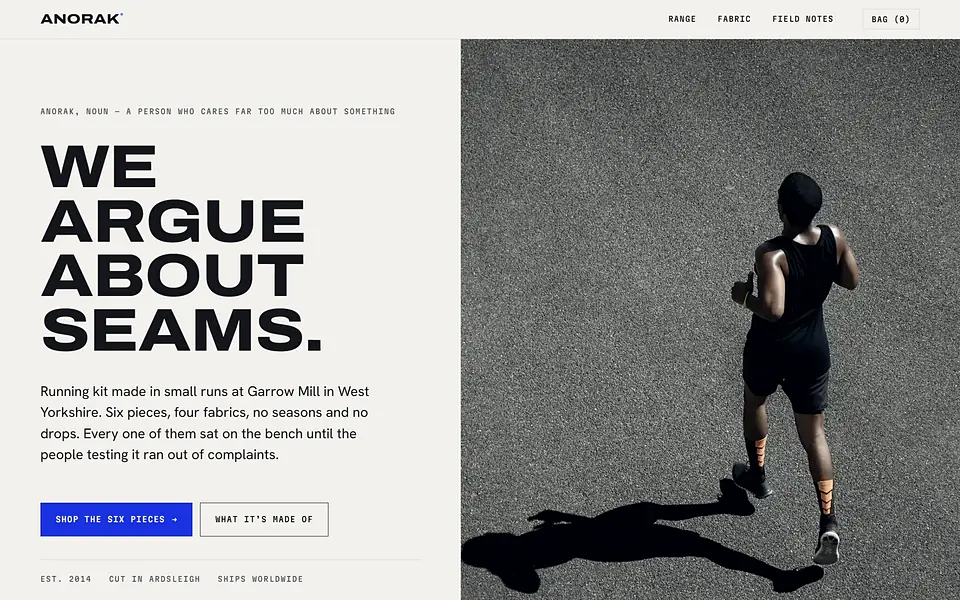 The ANORAK homepage: the words &lsquo;We argue about seams&rsquo; beside a runner photographed from overhead on grey asphalt.