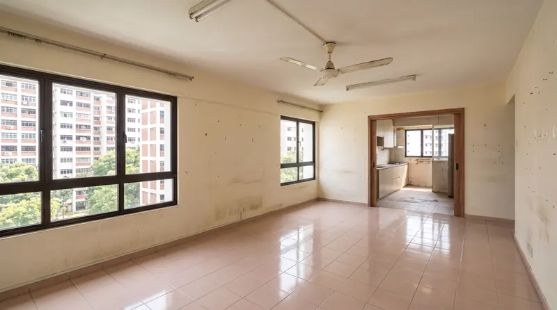 Before: the same room with glossy beige tiles, yellowed walls, a fluorescent tube and an old ceiling fan.